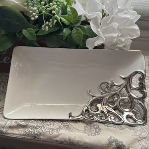Beautiful off plate with a silver scroll plate.